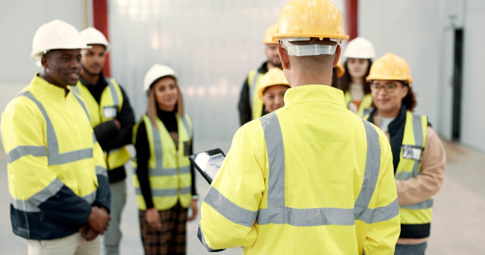 Group of students receiving on-site health & safety training from an instructor.