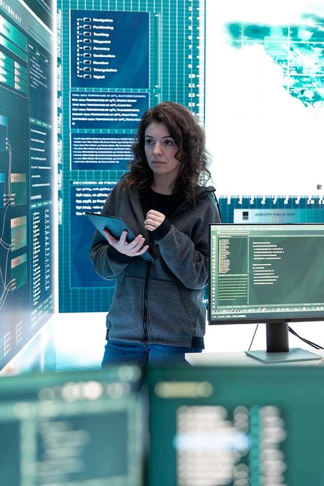 A female developer working in a cyber security centre